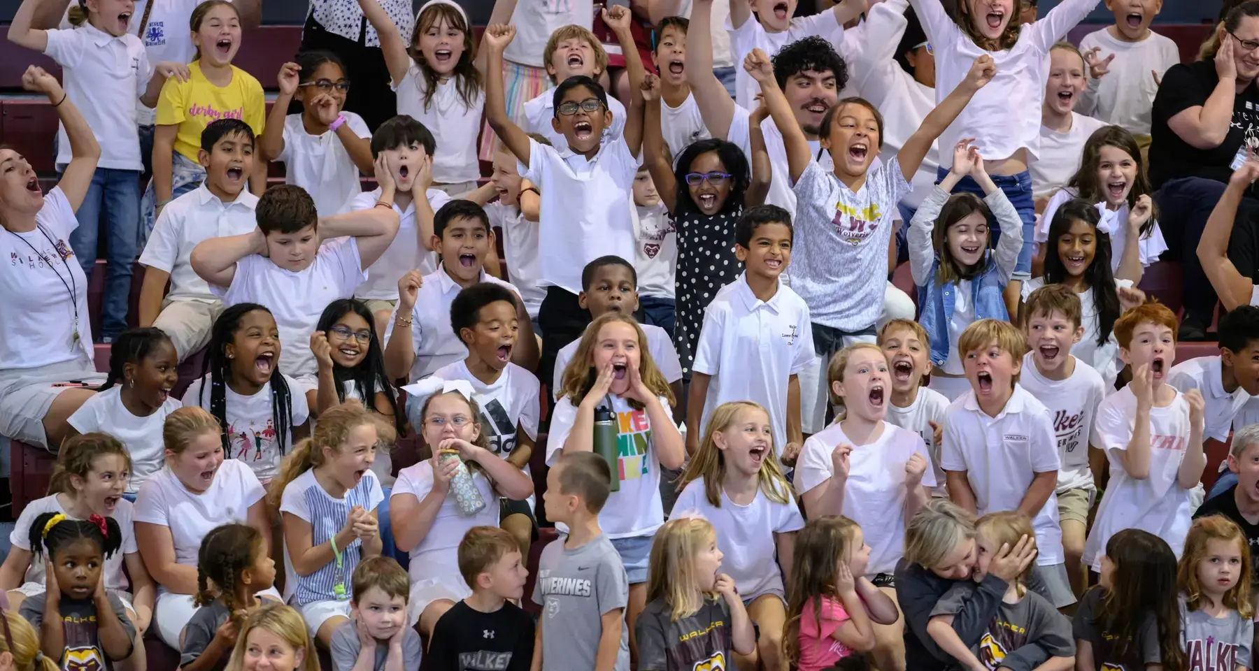 Children cheering from the bleachers