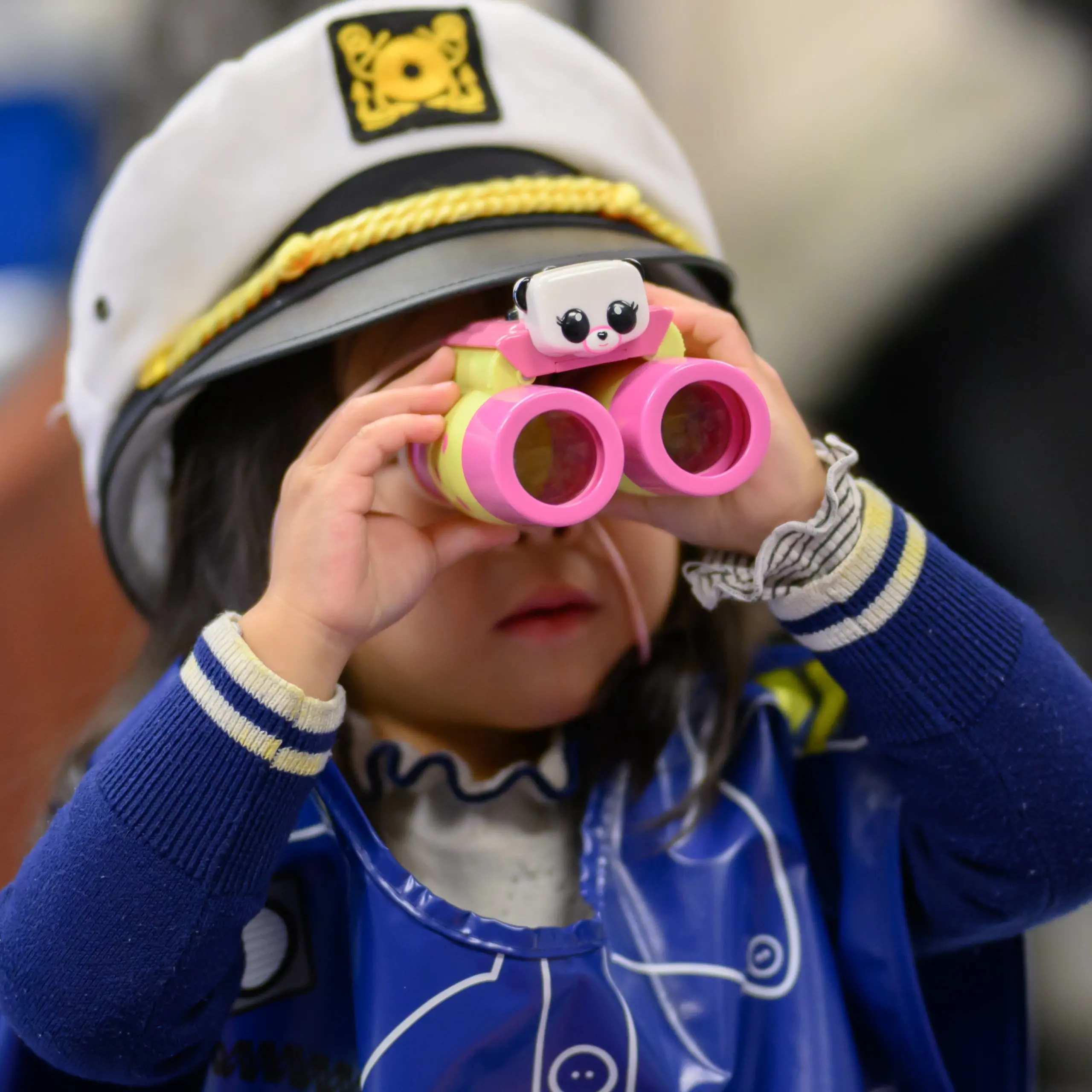 Child looking through binoculars