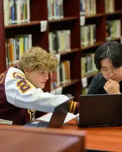 Students collaborating in the library