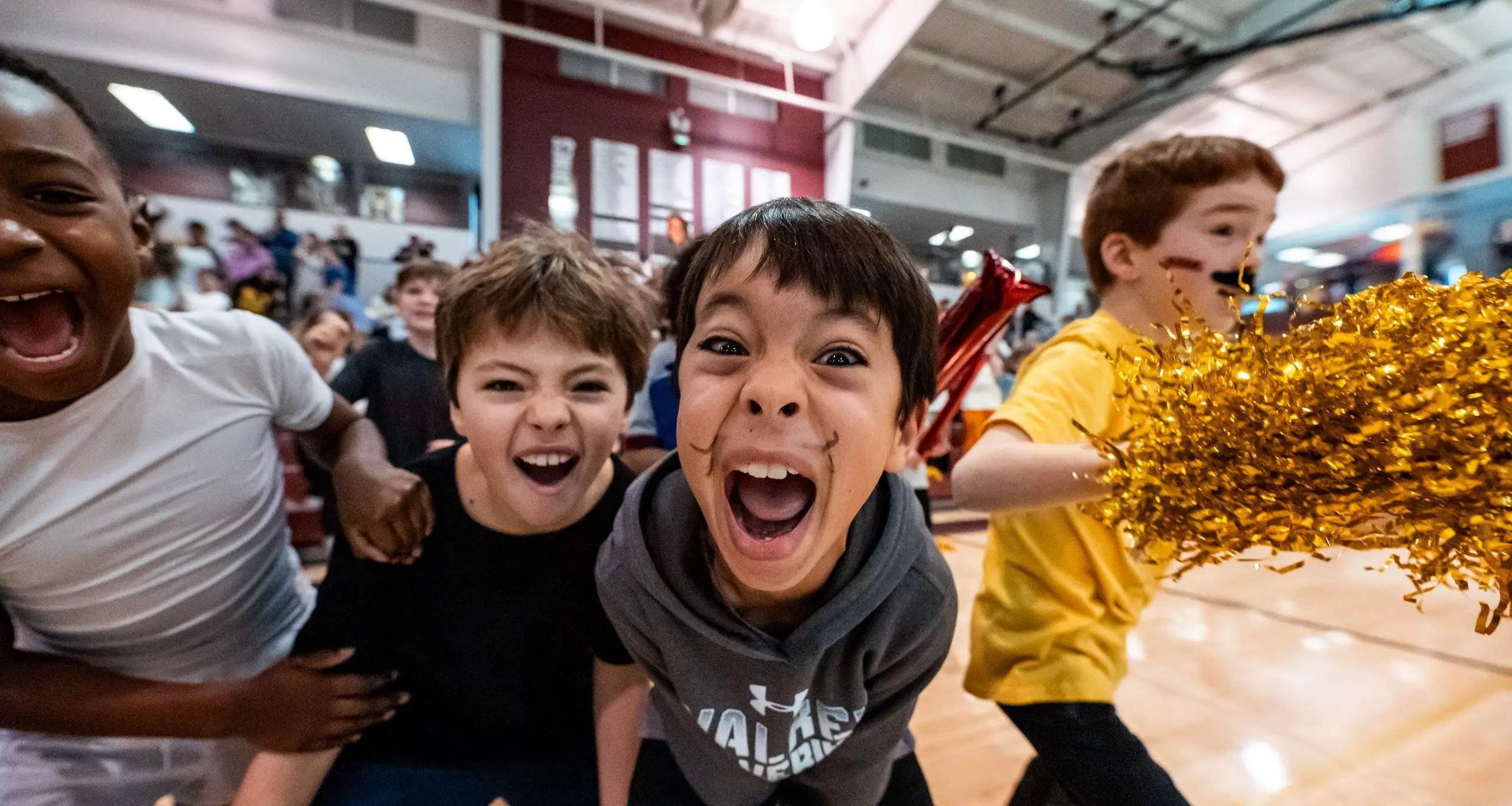 Walker students cheering while facing the camera