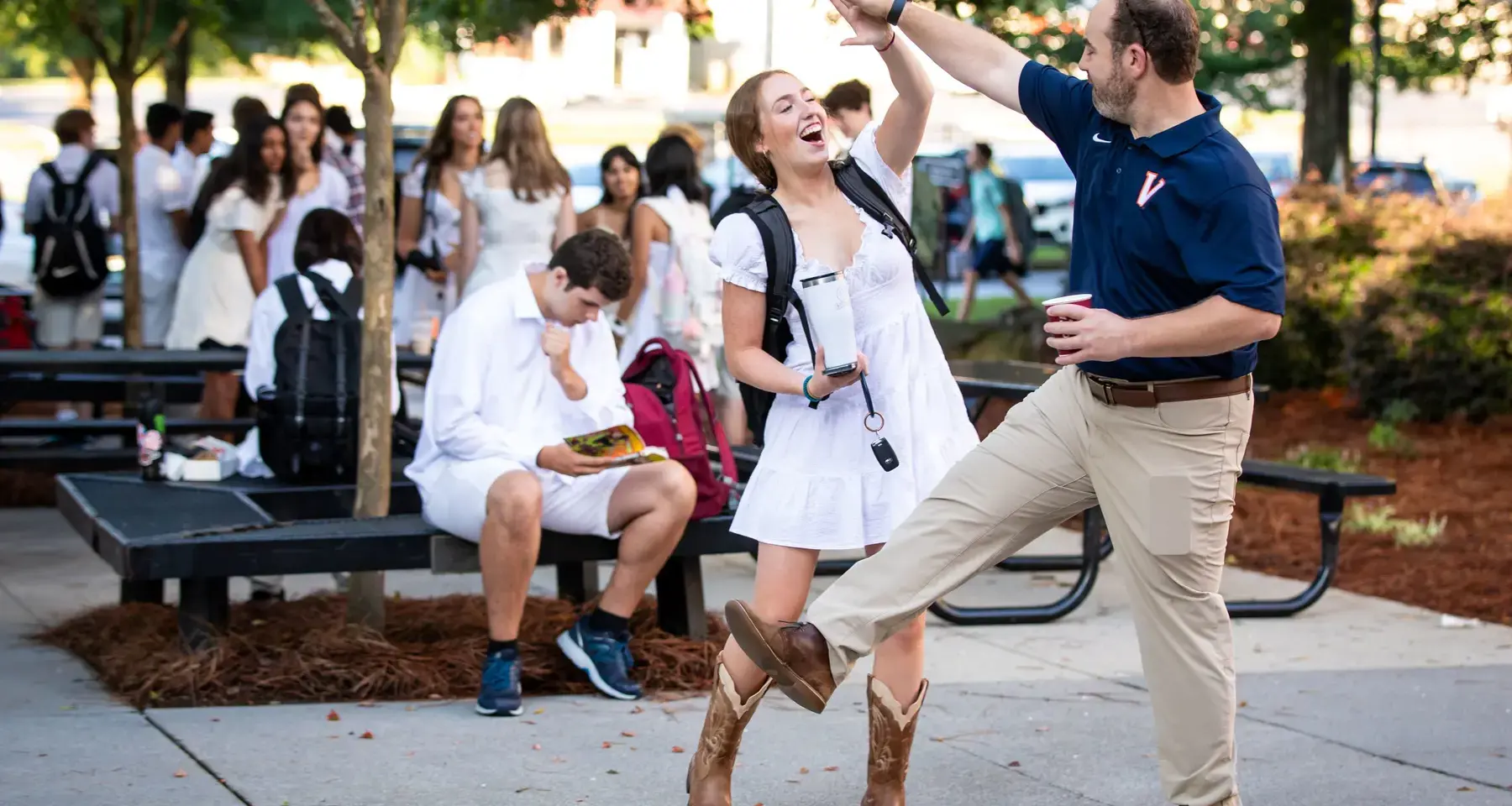 Student high-fiving teacher