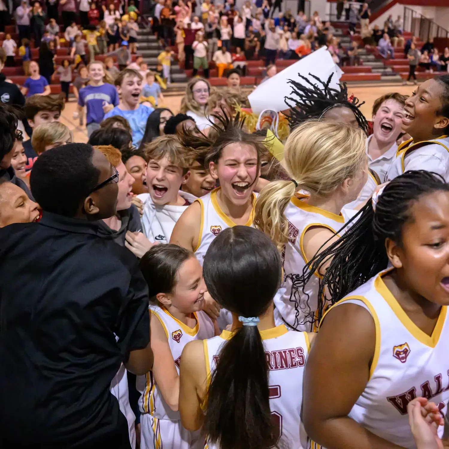 Student athletes celebrating a win