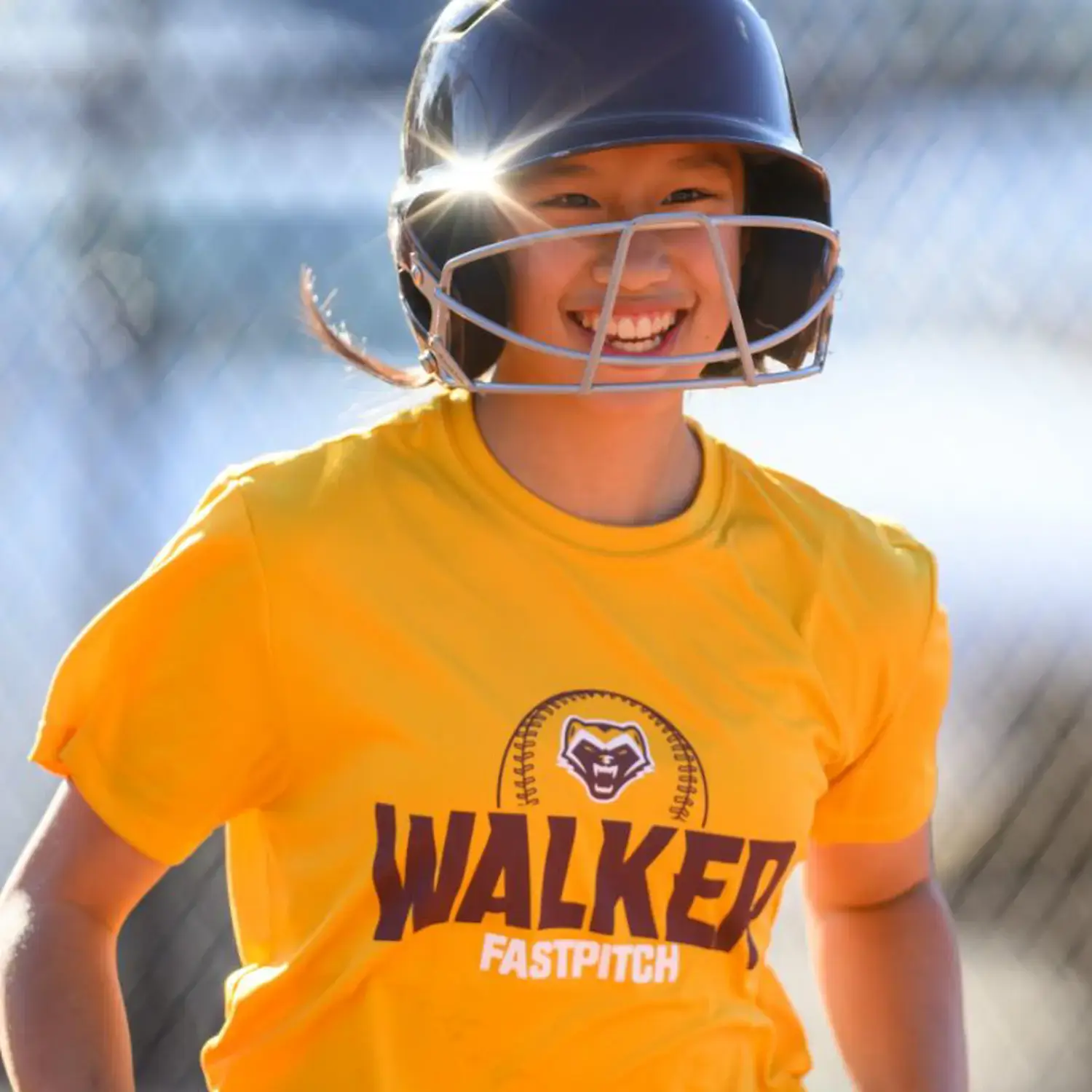 Softball player smiling