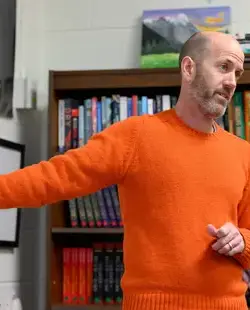 Teacher pointing at whiteboard