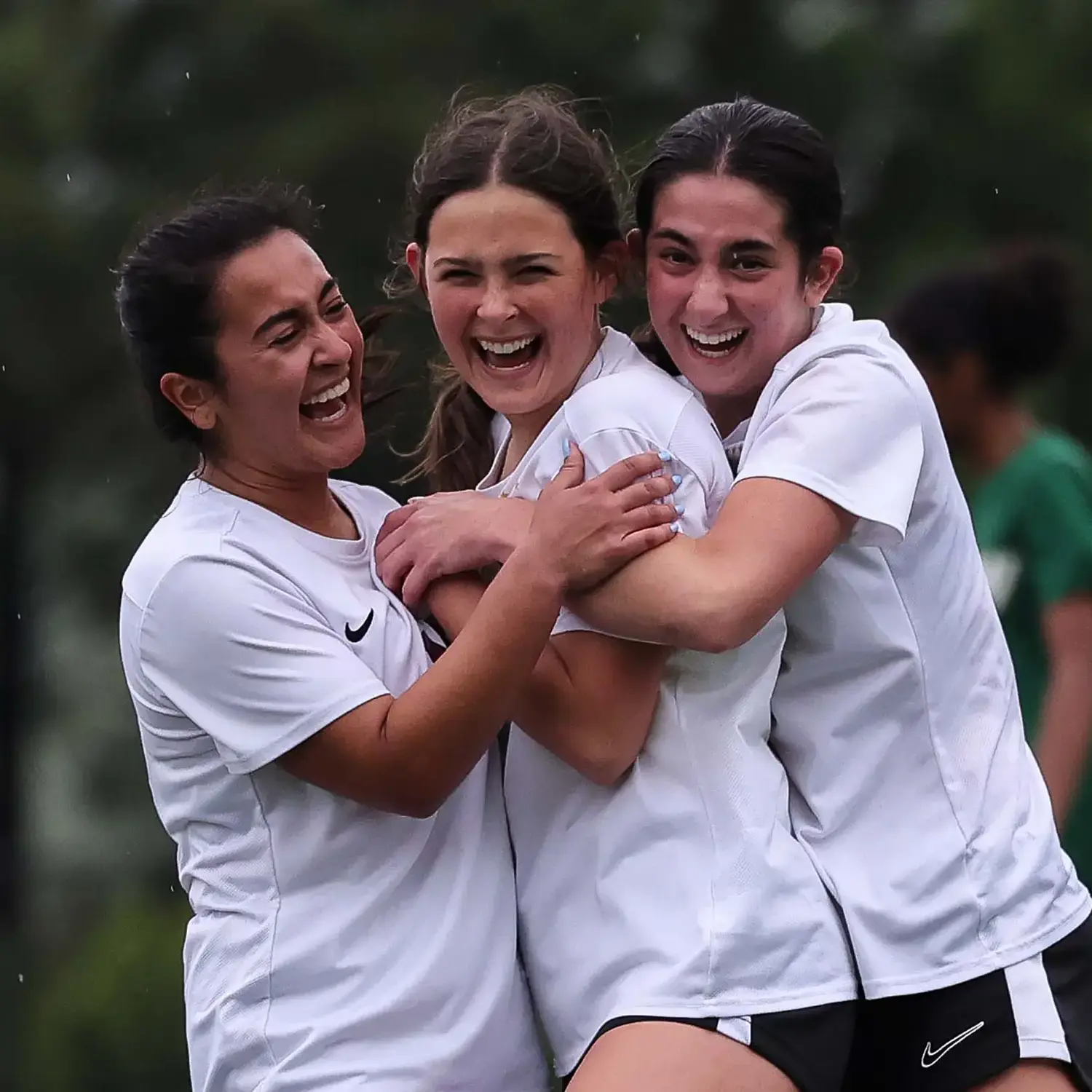 Student soccer players celebrating