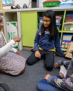 Students sitting on carpet