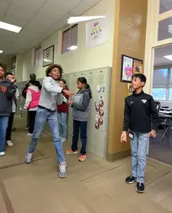 Students throwing paper planes in the halls