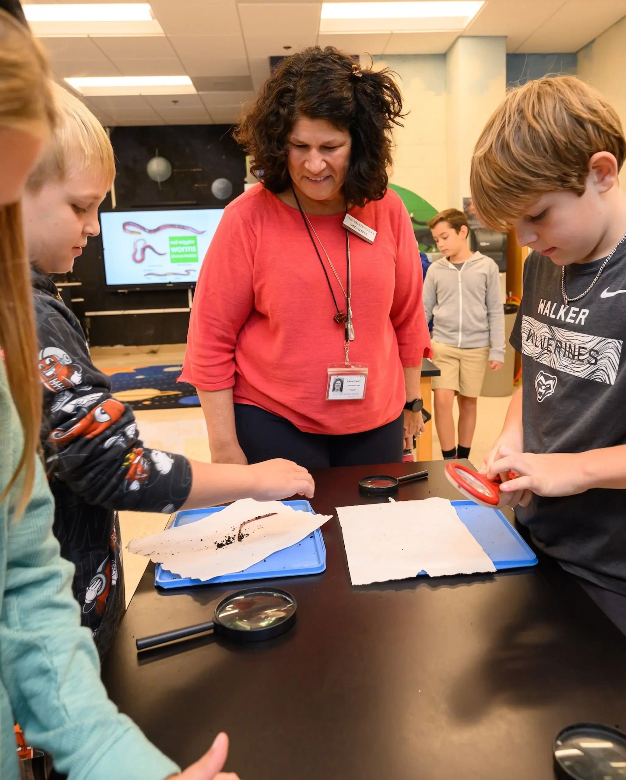 Walker teacher teaching student in classroom