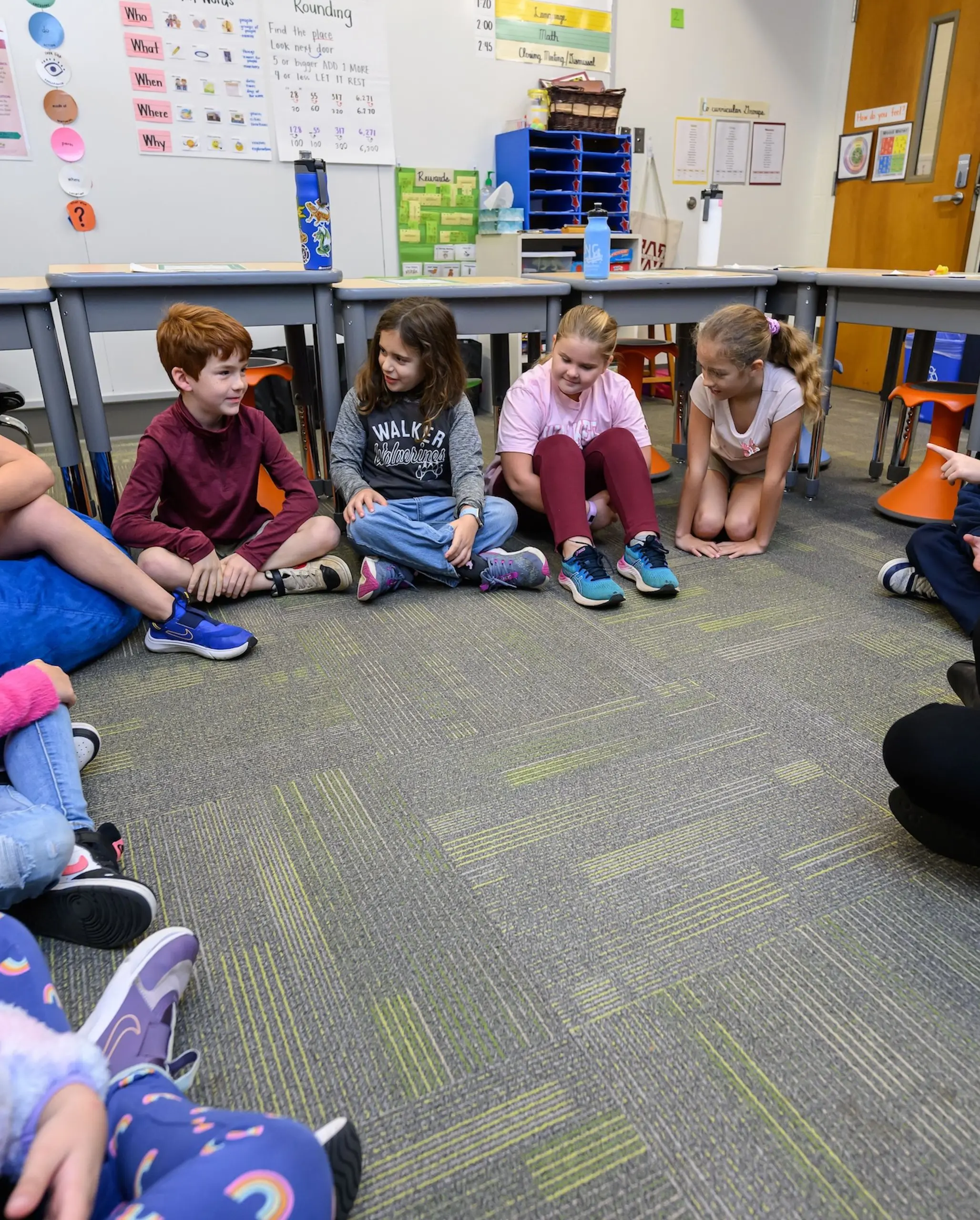 Walker students in circle on carpet