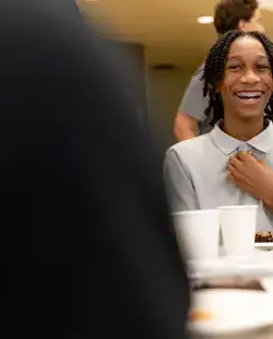 Student laughing at breakfast 